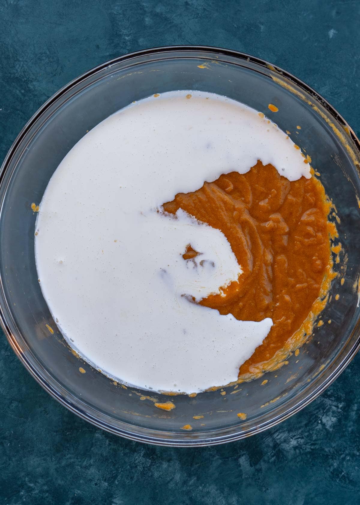 pumpkin pie filling with heavy cream in bowl