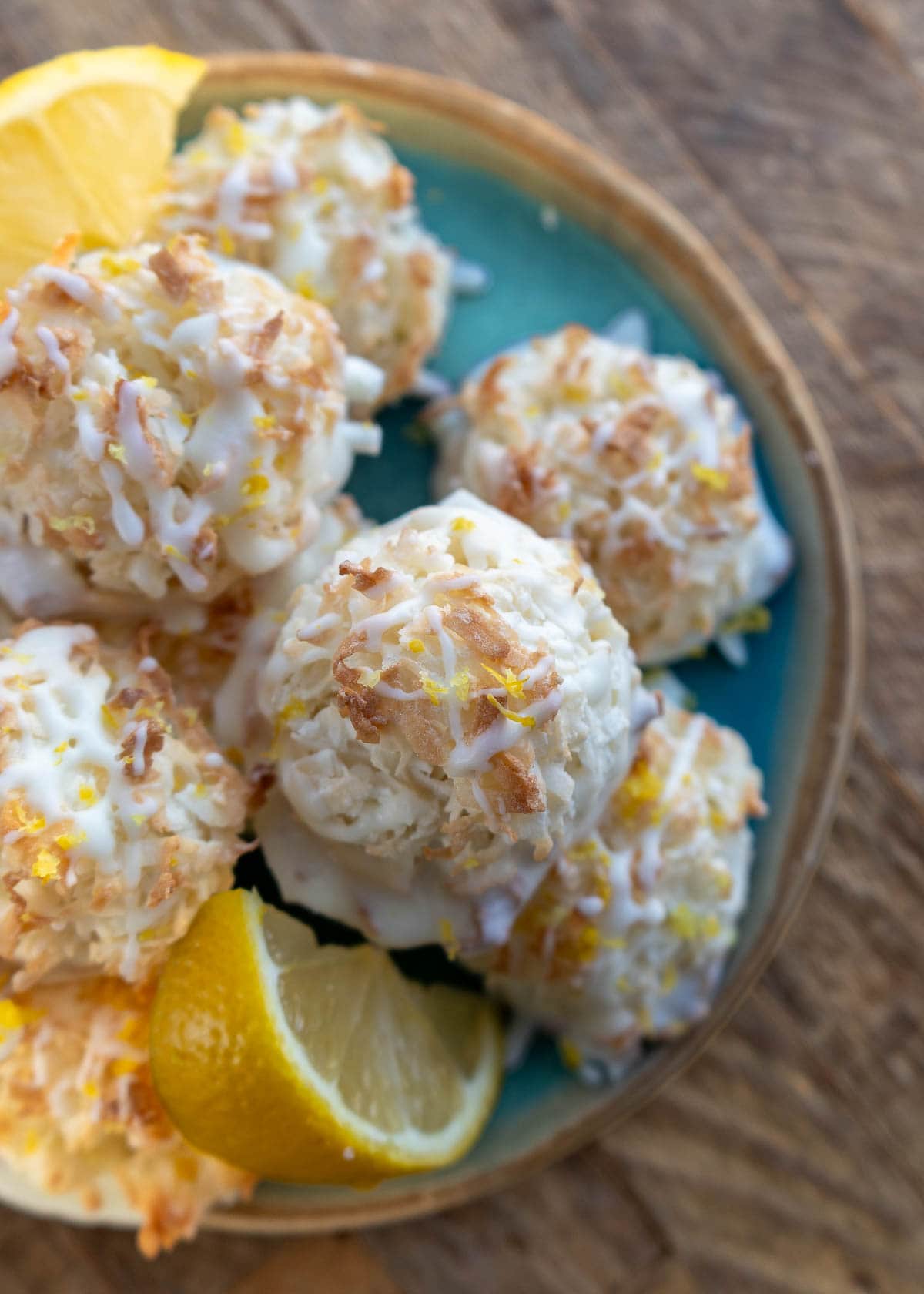 an overhead shot of coconut macaroons with lemon slices
