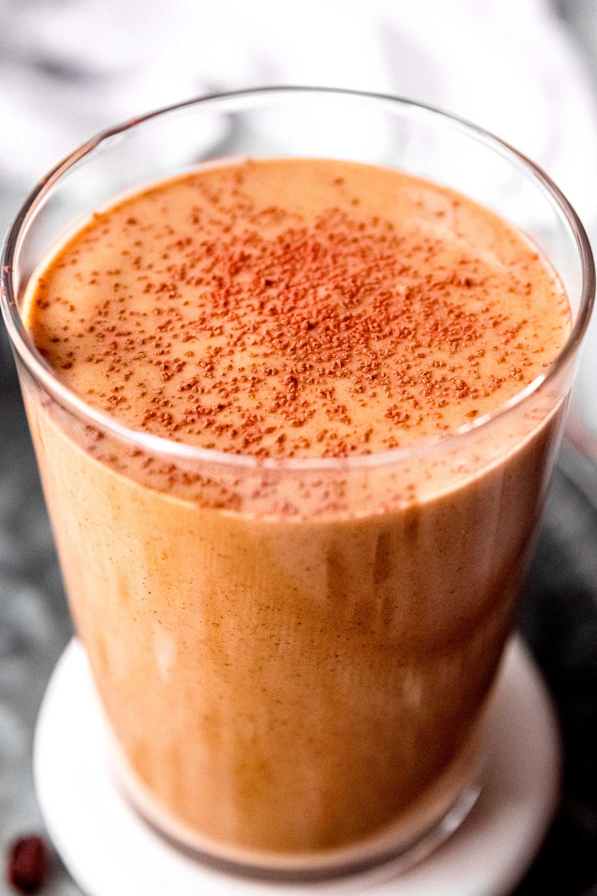 closeup of keto coffee smoothie with cocoa powder sprinkled on top