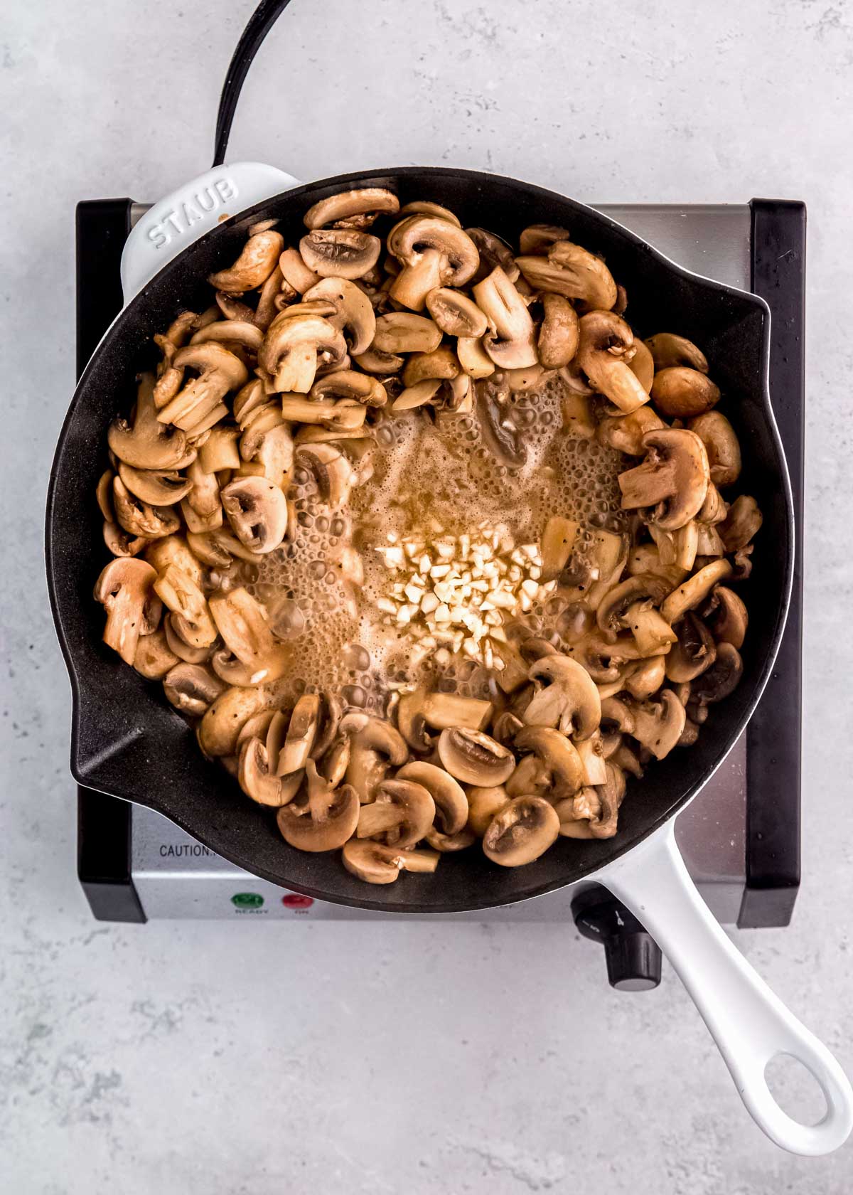 worcestershire sauce, garlic, and butter added to sauteed mushrooms