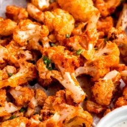 close up image of buffalo cauliflower on a sheet pan