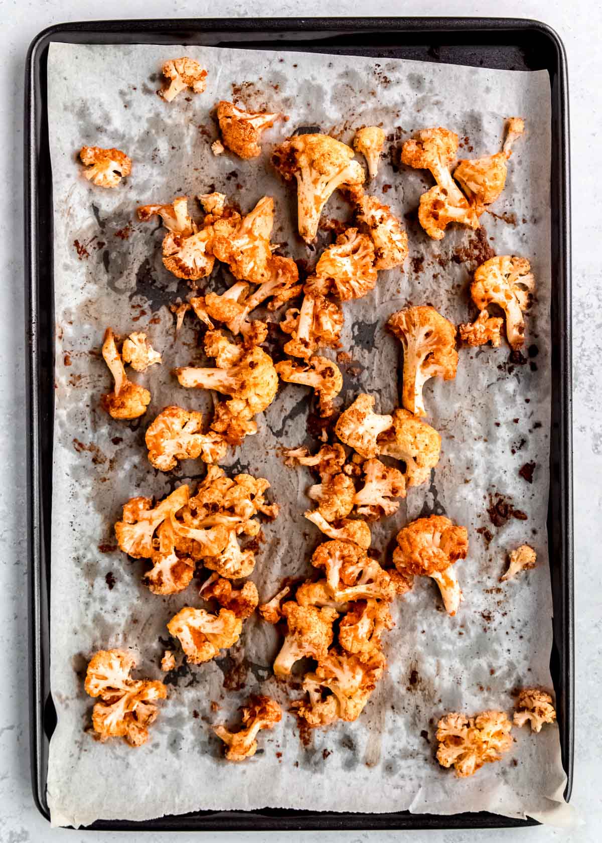 buffalo cauliflower on a baking sheet