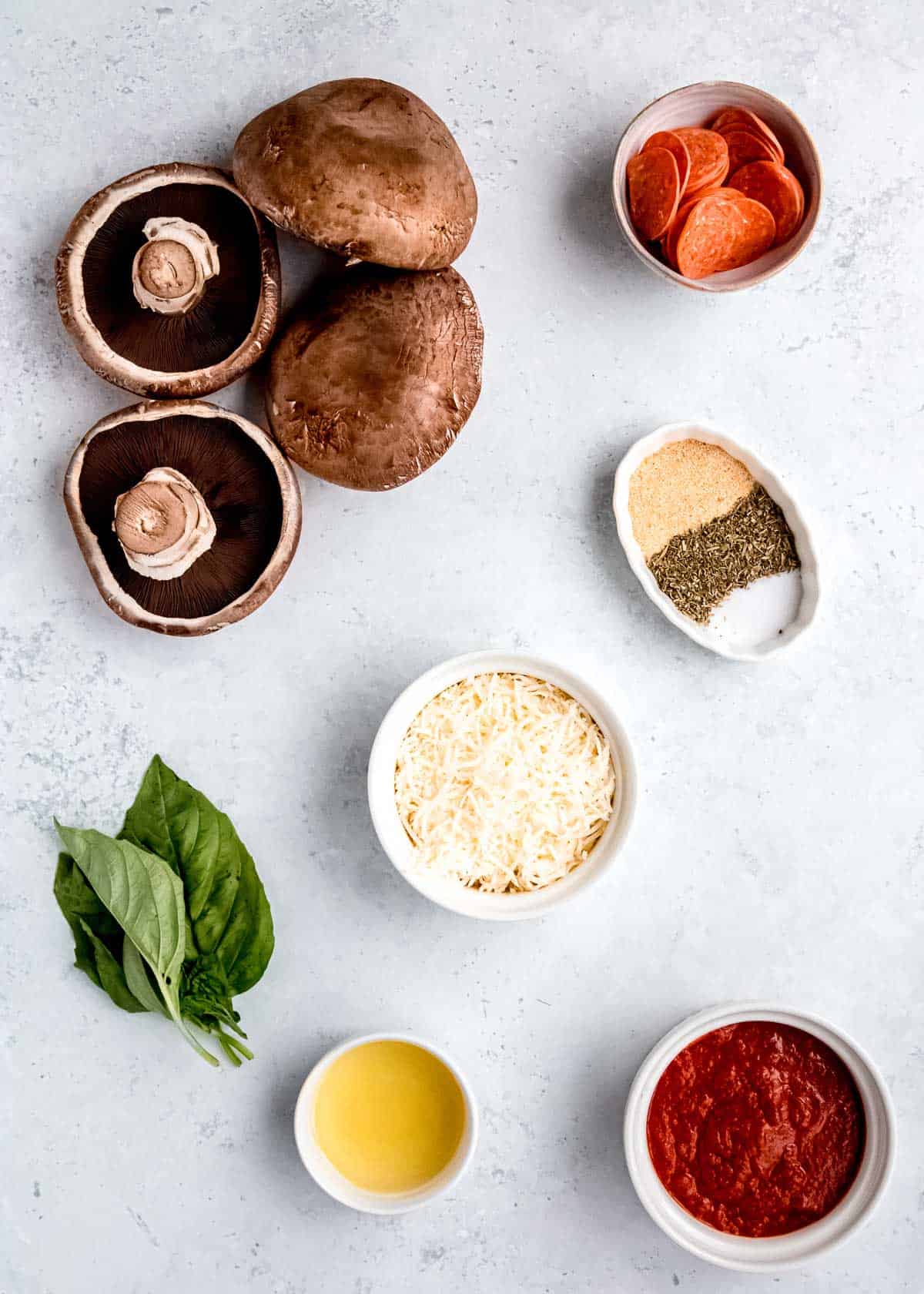 pepperoni pizza stuffed mushrooms ingredients on a white table