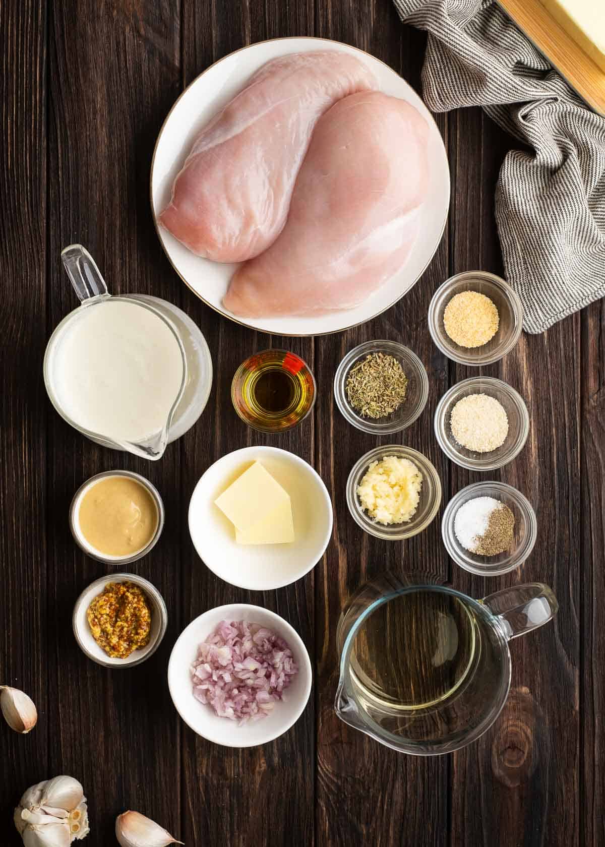 Overhead shot of mustard chicken ingredients on a wooden table