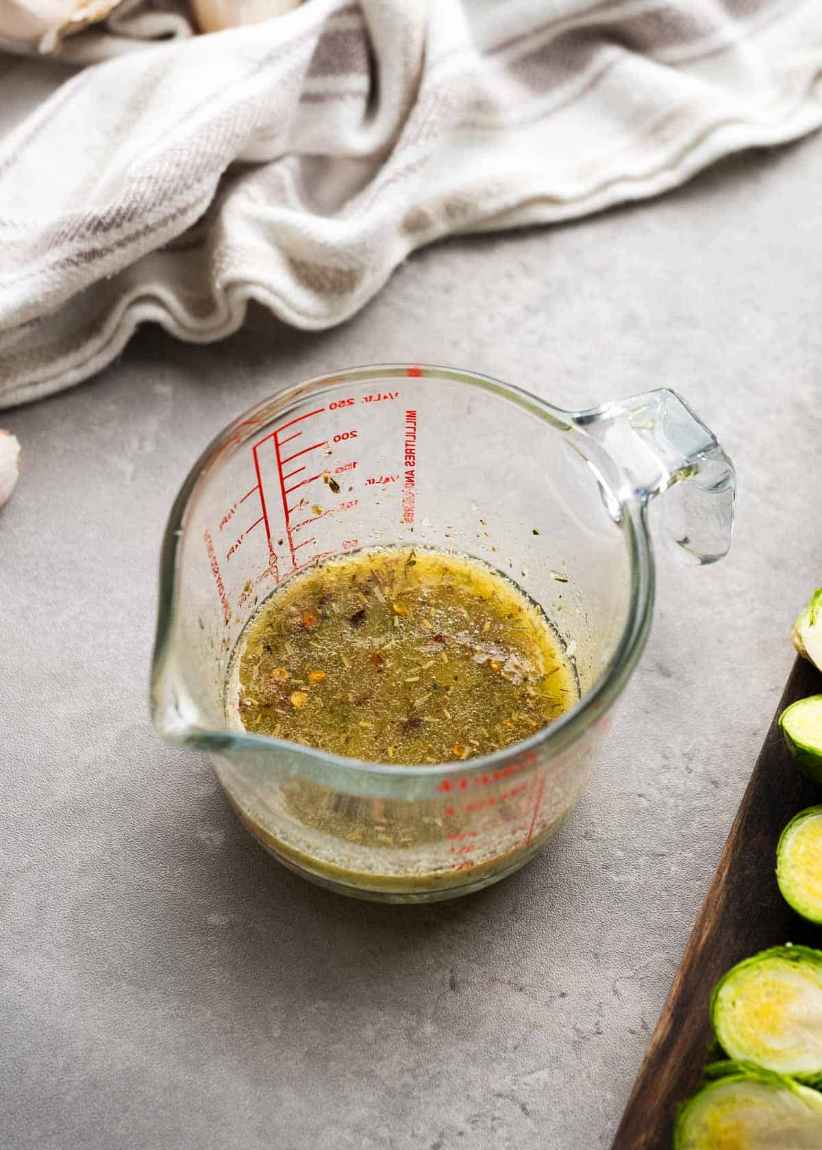 garlic butter mixture in a clear measuring cup