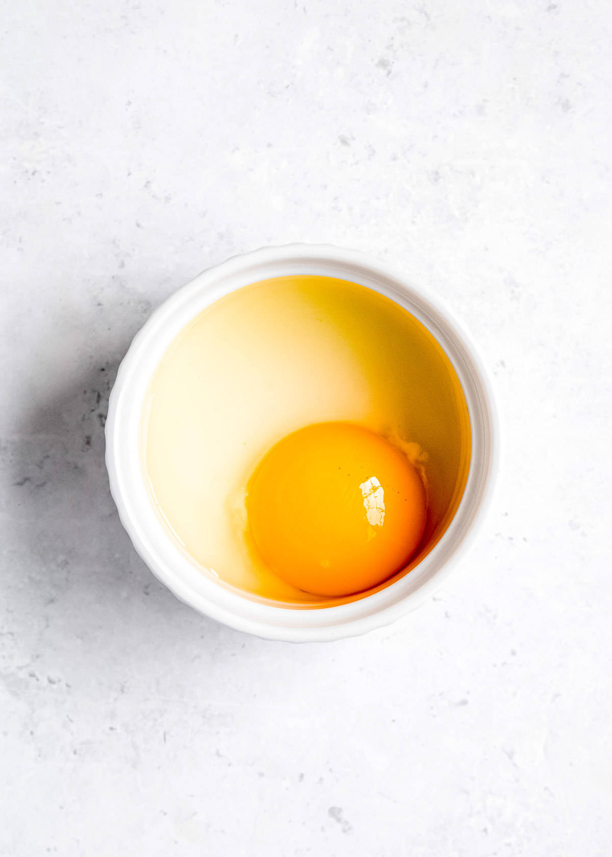 strained egg in a white bowl
