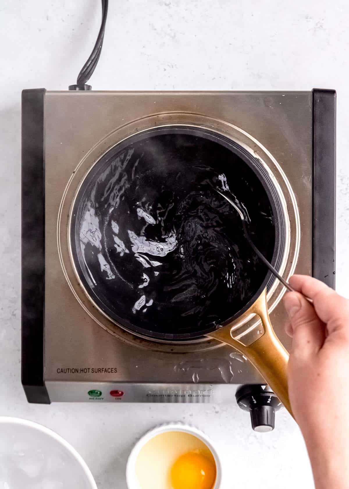 overhead image of simmering water in a pot