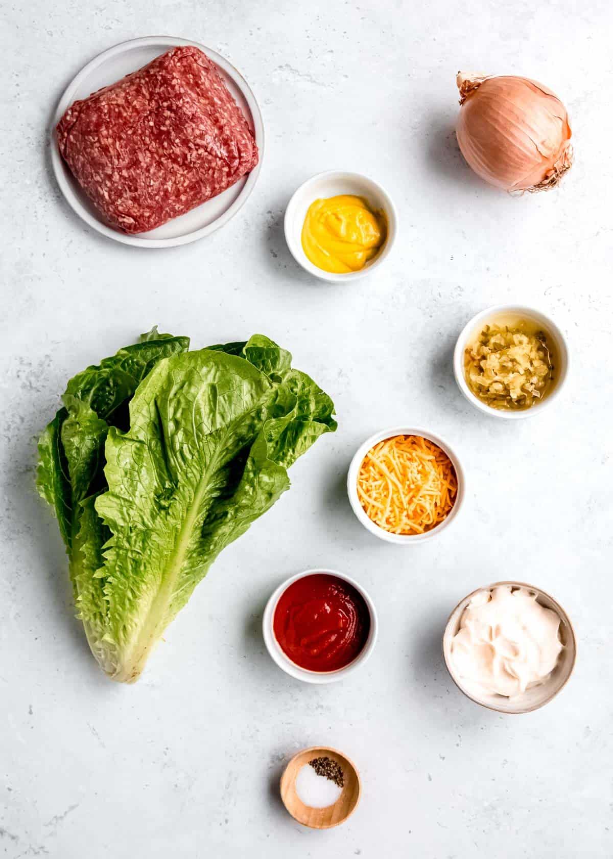 lettuce wrap burger ingredients on a white table