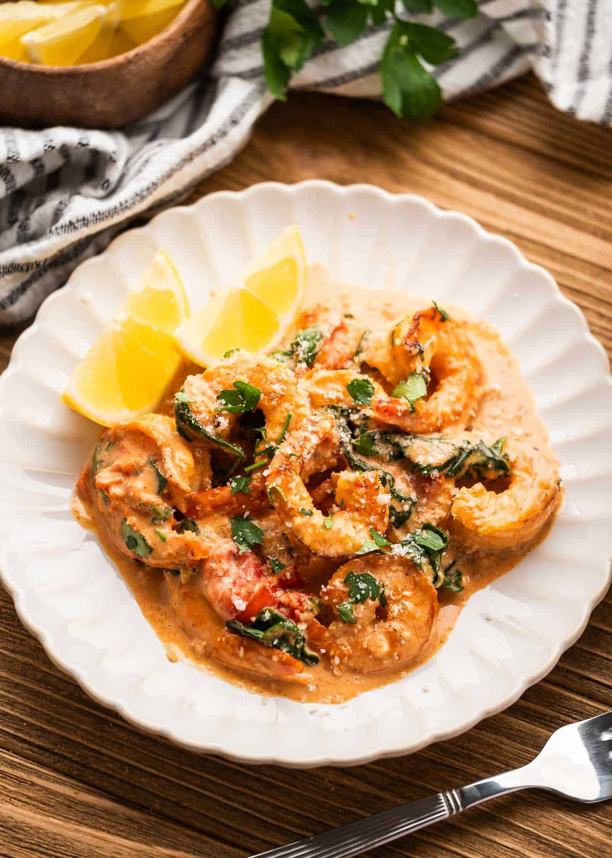 overhead image of tuscan shrimp on a white plate 