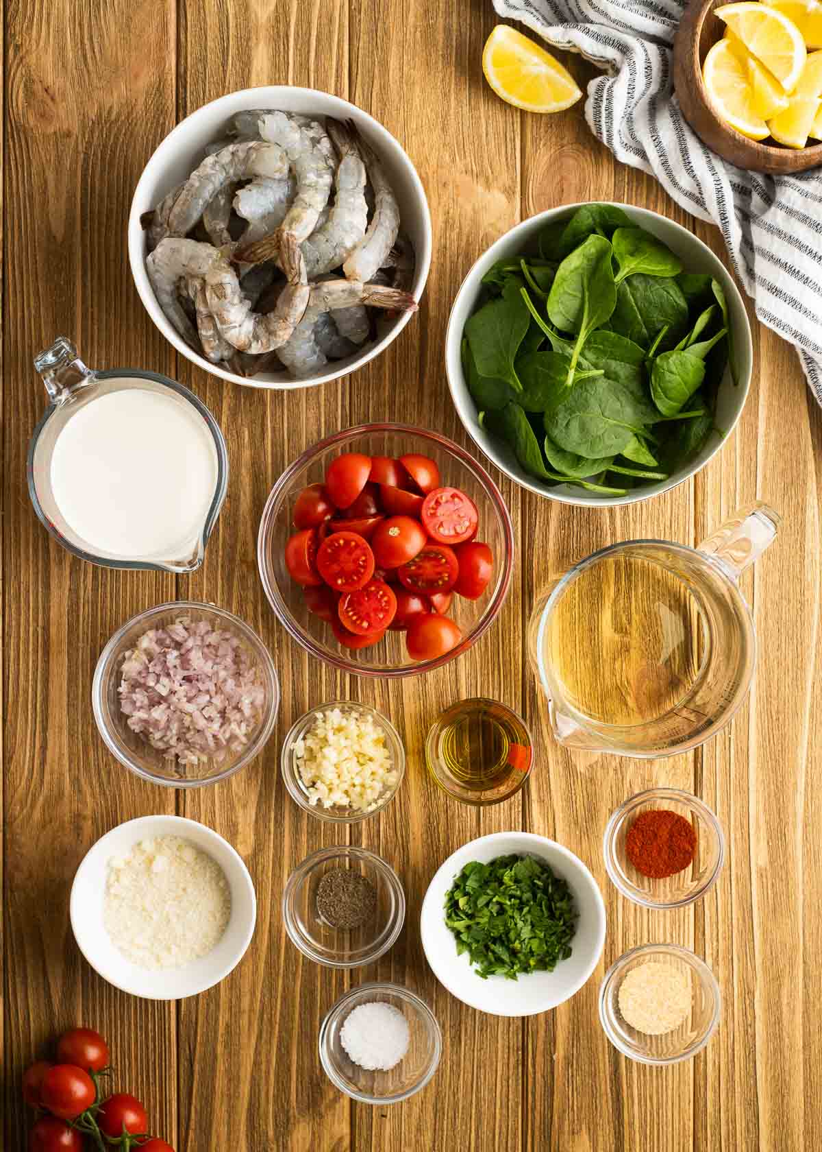 overhead image of tuscan shrimp ingredients on a wooden table