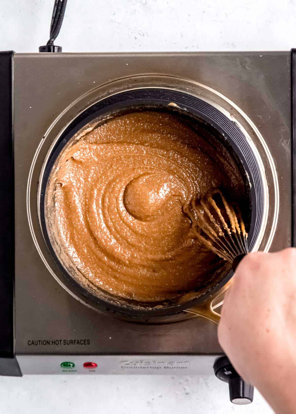 overhead image of truffle ingredients being whisked in pot