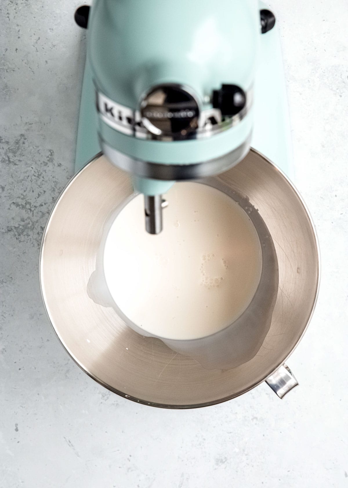 overhead image of heavy cream in a mixer