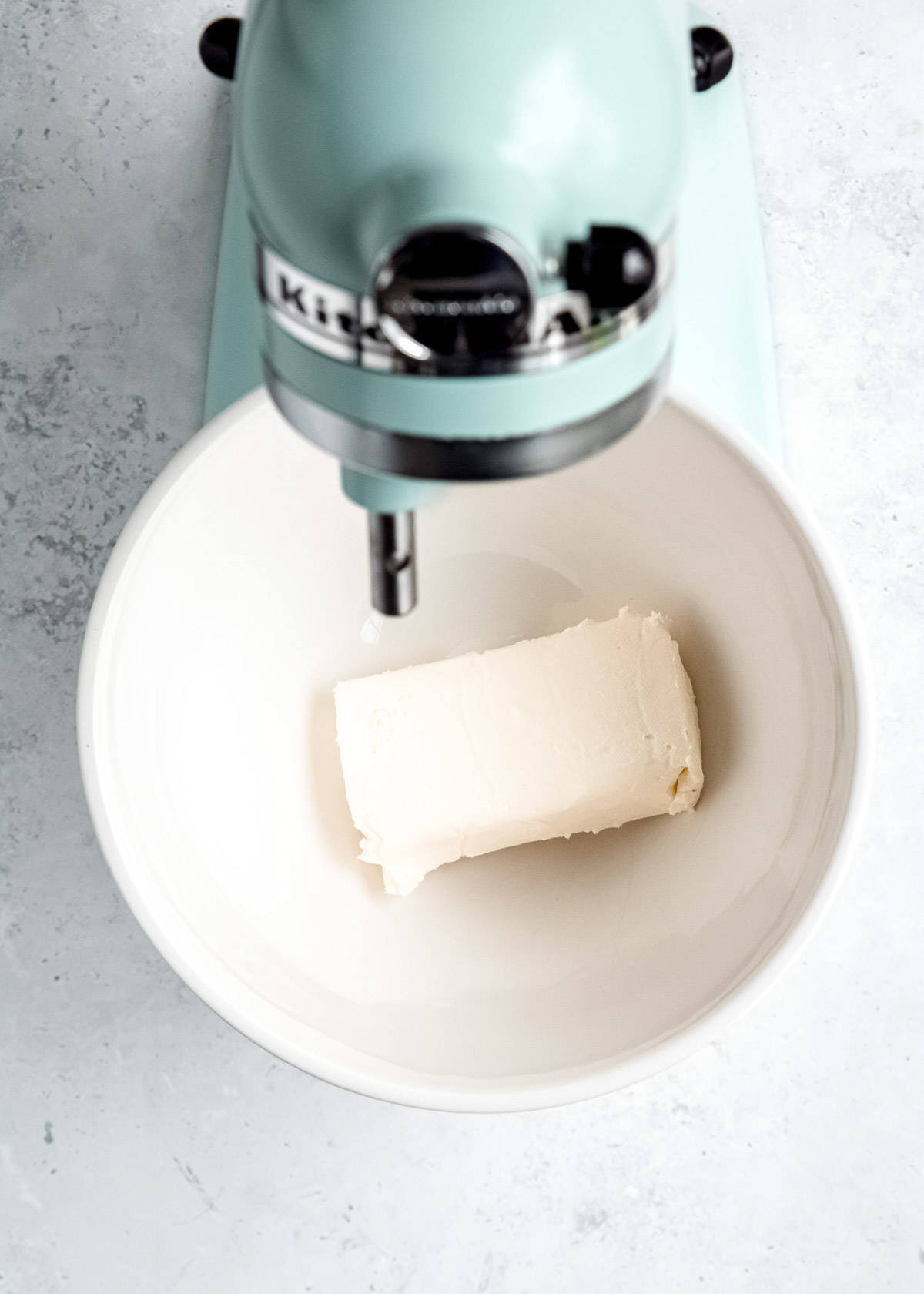 overhead image of cream cheese bar in a mixing bowl