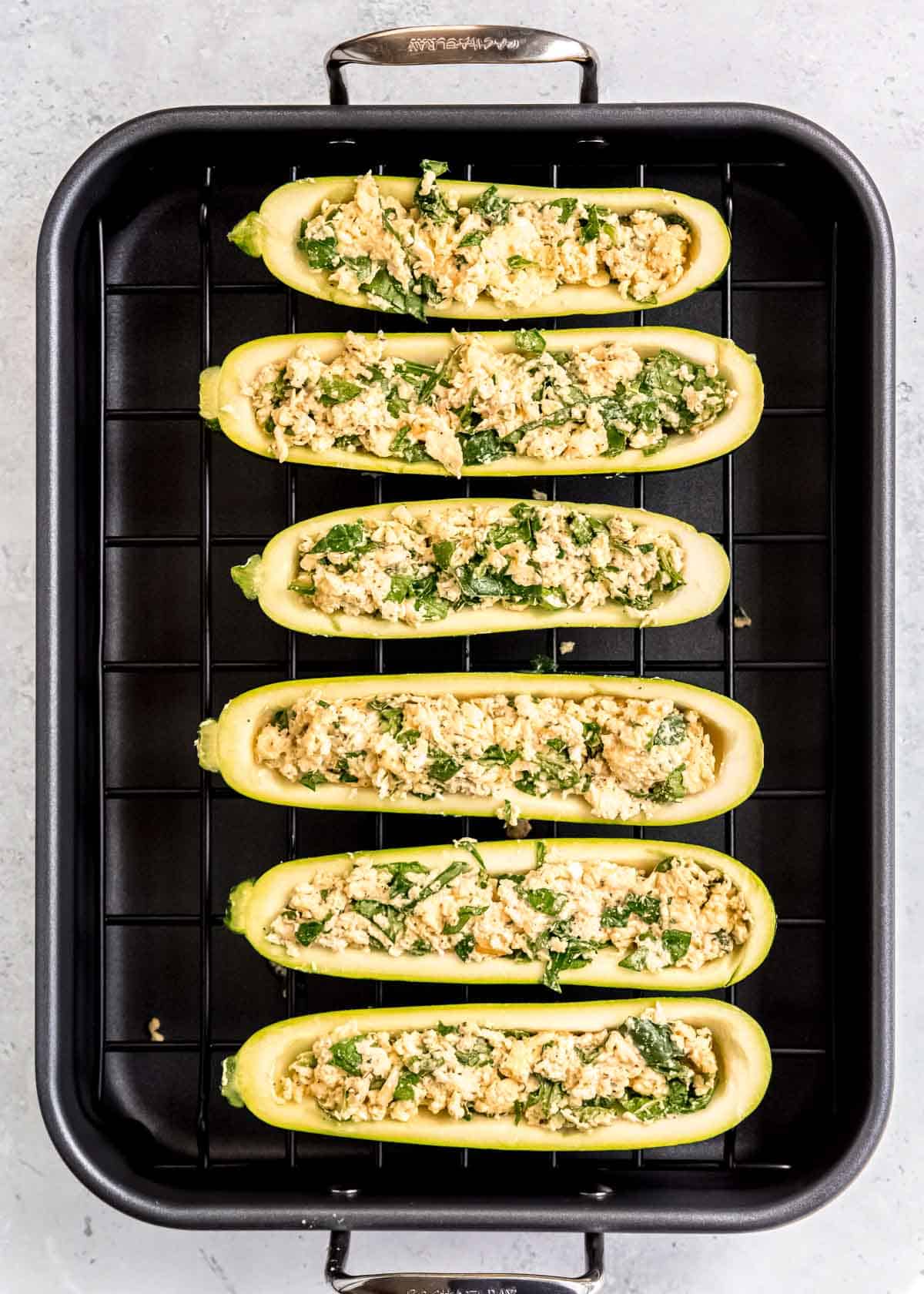 filling being added to zucchini boats 