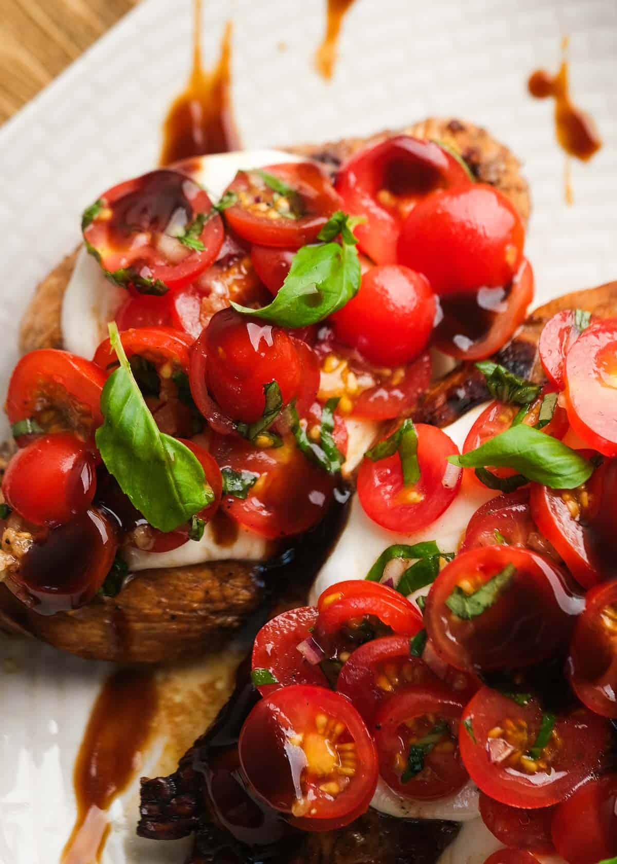 close up image of bruschetta chicken on a white plate