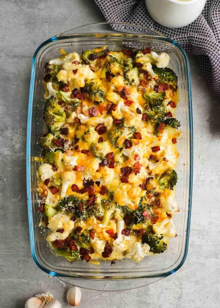 cooked broccoli cauliflower casserole topped with crunchy bacon pieces