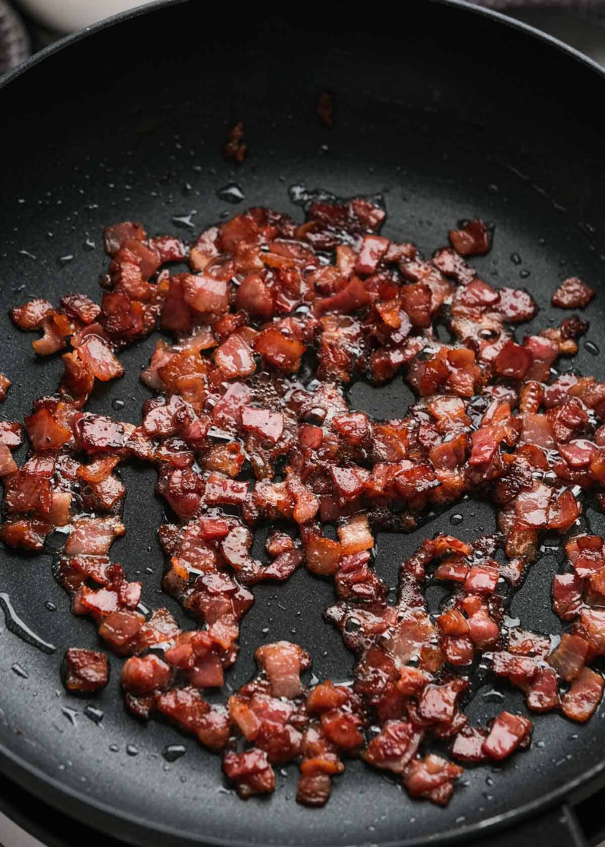 crispy bacon pieces in a skillet