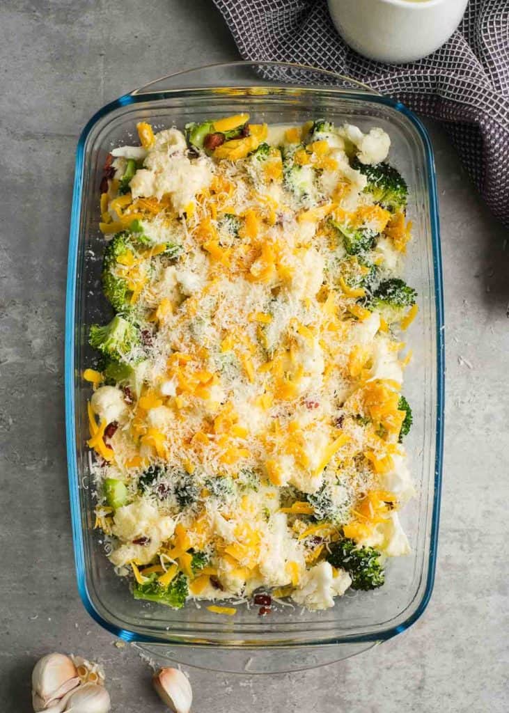 lightly roasted broccoli and cauliflower covered in a cheesy sauce, shredded cheese, and parmesan