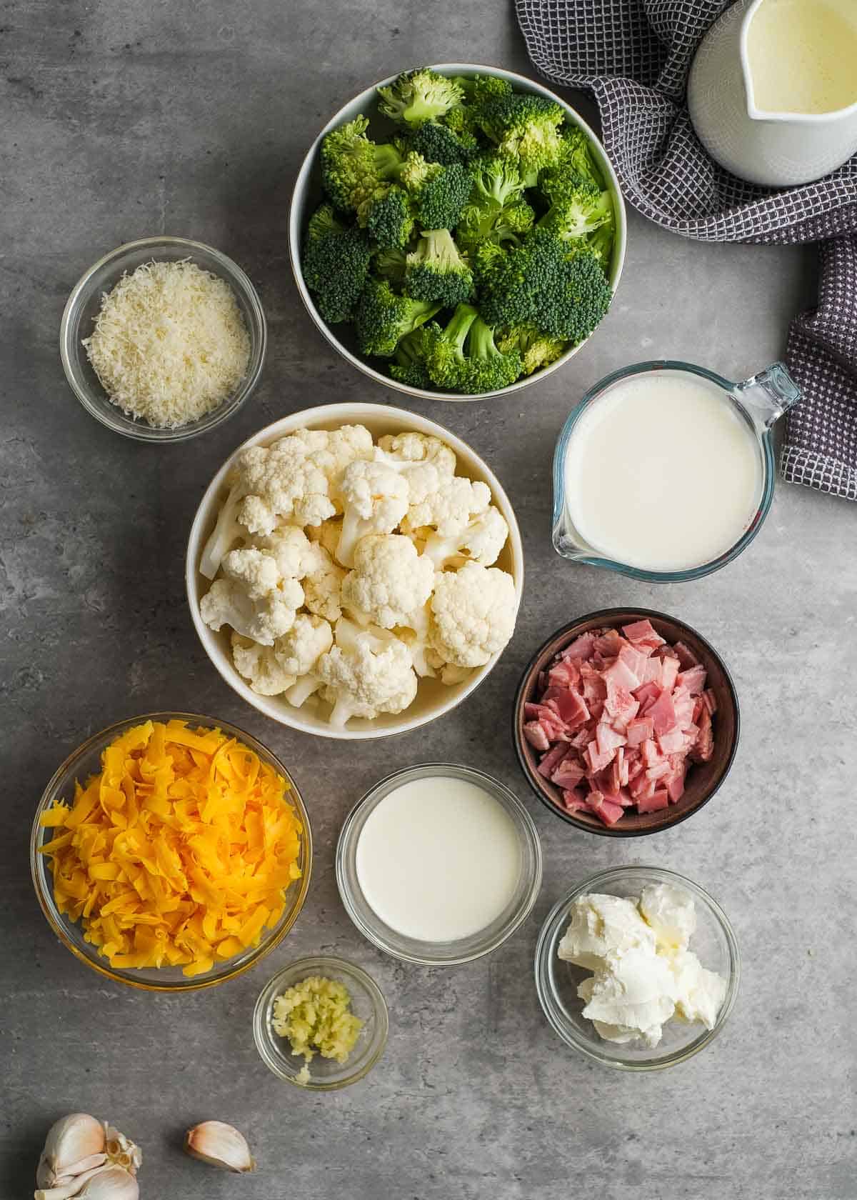 ingredients for broccoli cauliflower casserole in individual bowls