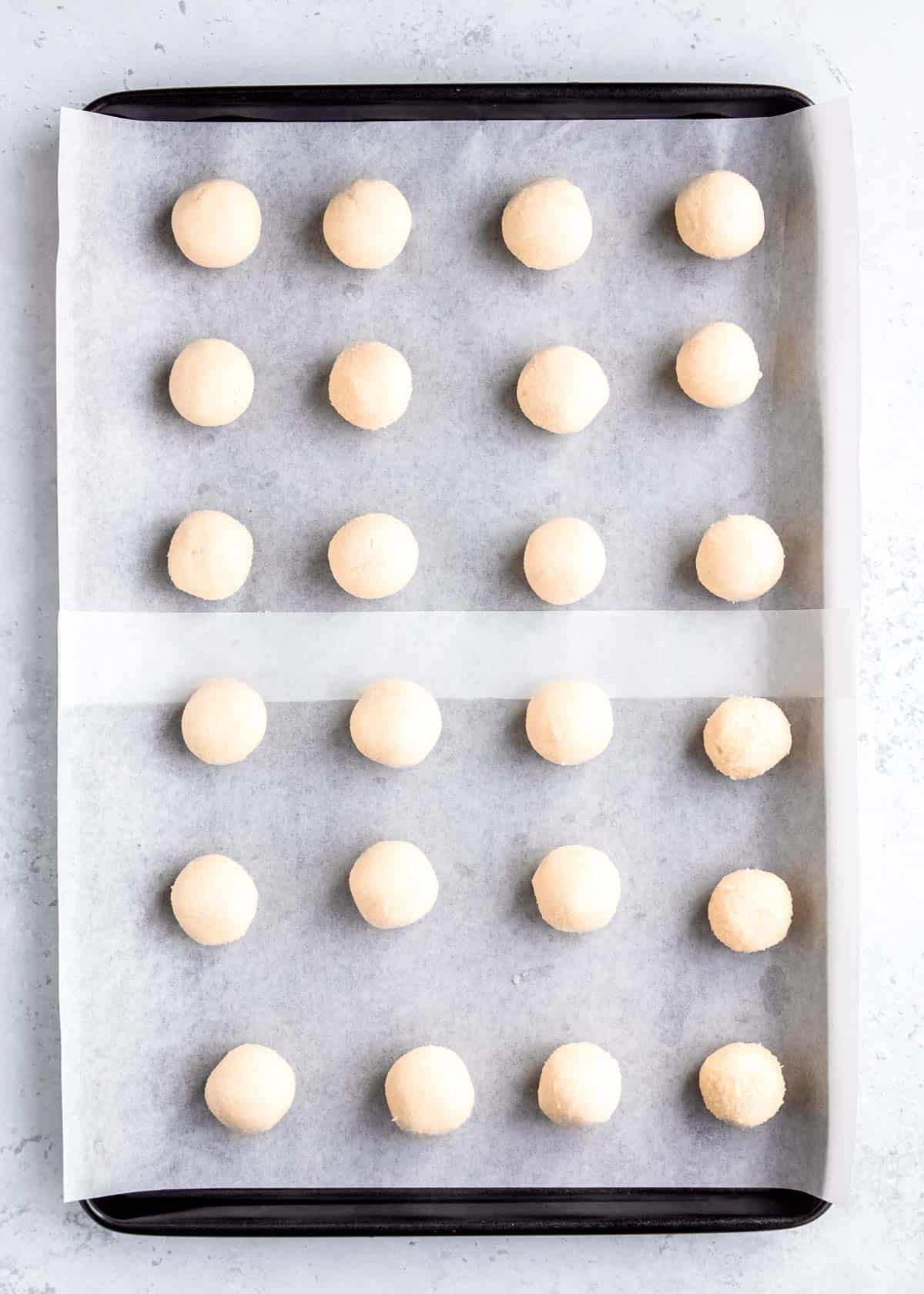 frozen formed truffles on a linked baking sheet