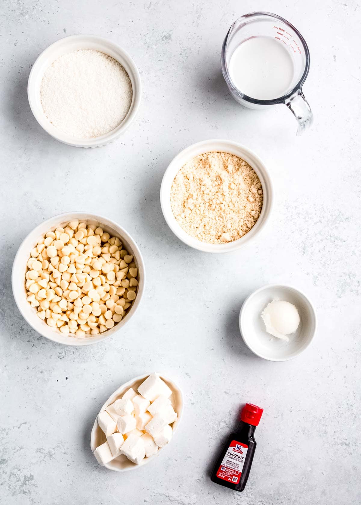 overhead image of coconut truffle ingredients on a white table