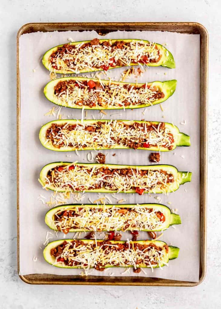 enchilada stuffed zucchini boats topped with cheese