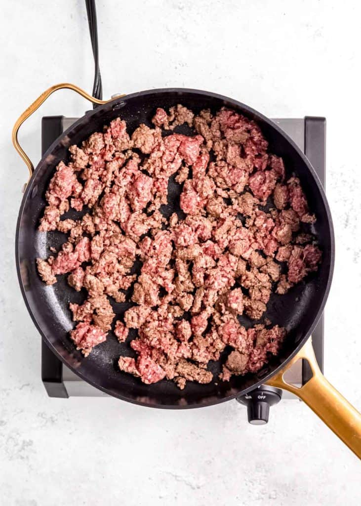 ground beef browning in a skillet