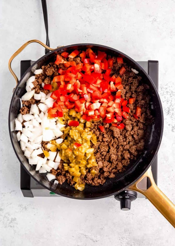 seasoned ground beef with diced onion, chopped bell peppers, and green chiles