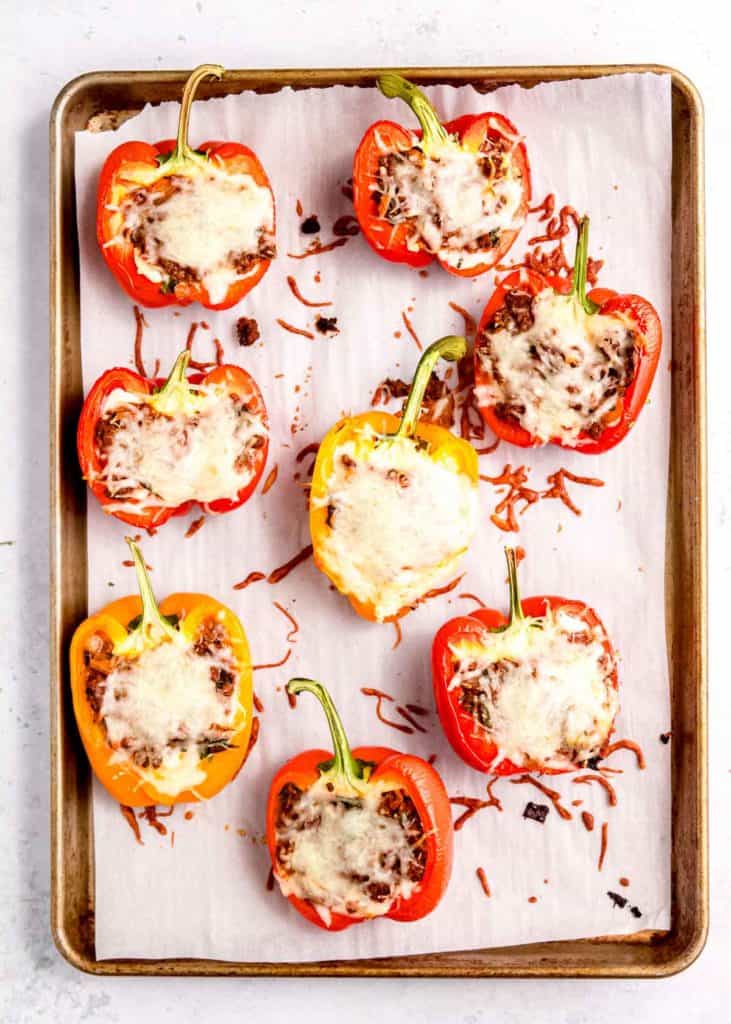 cooked lasagna stuffed peppers on baking sheet