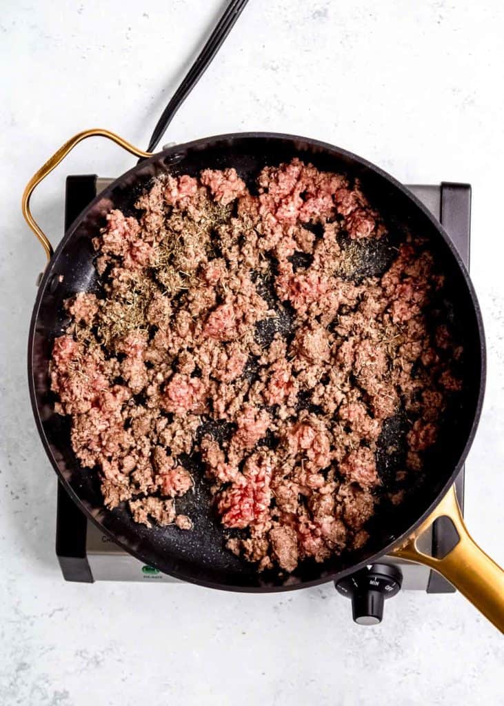 ground beef cooking in skillet