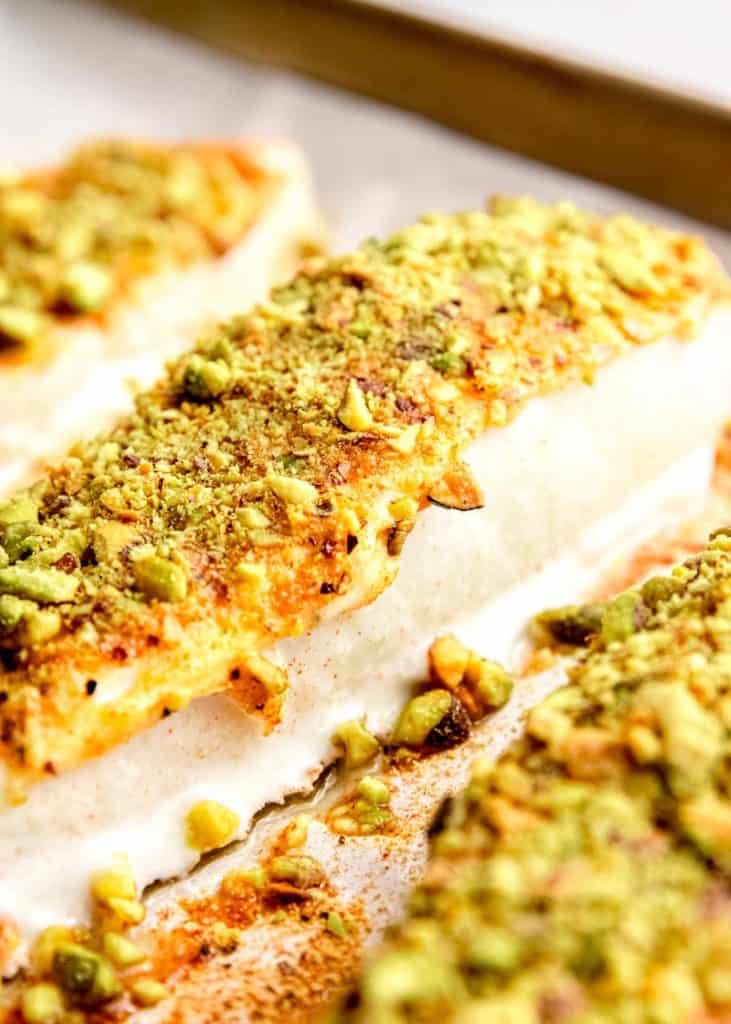 close up image of cooked  pistachio crusted halibut filet