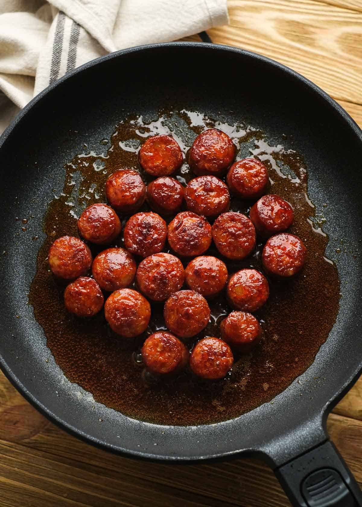 browned sausage in a cast iron skillet