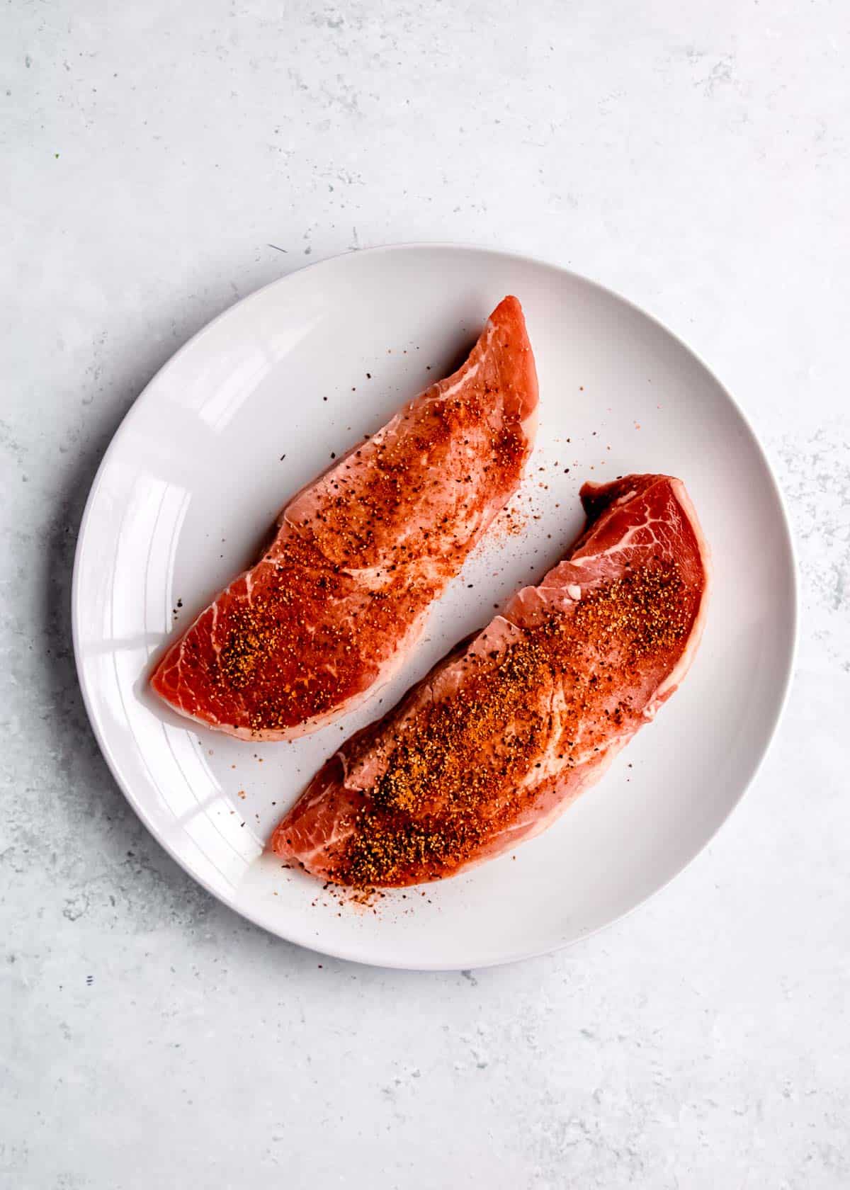 seasoned sirloin steak on white plate