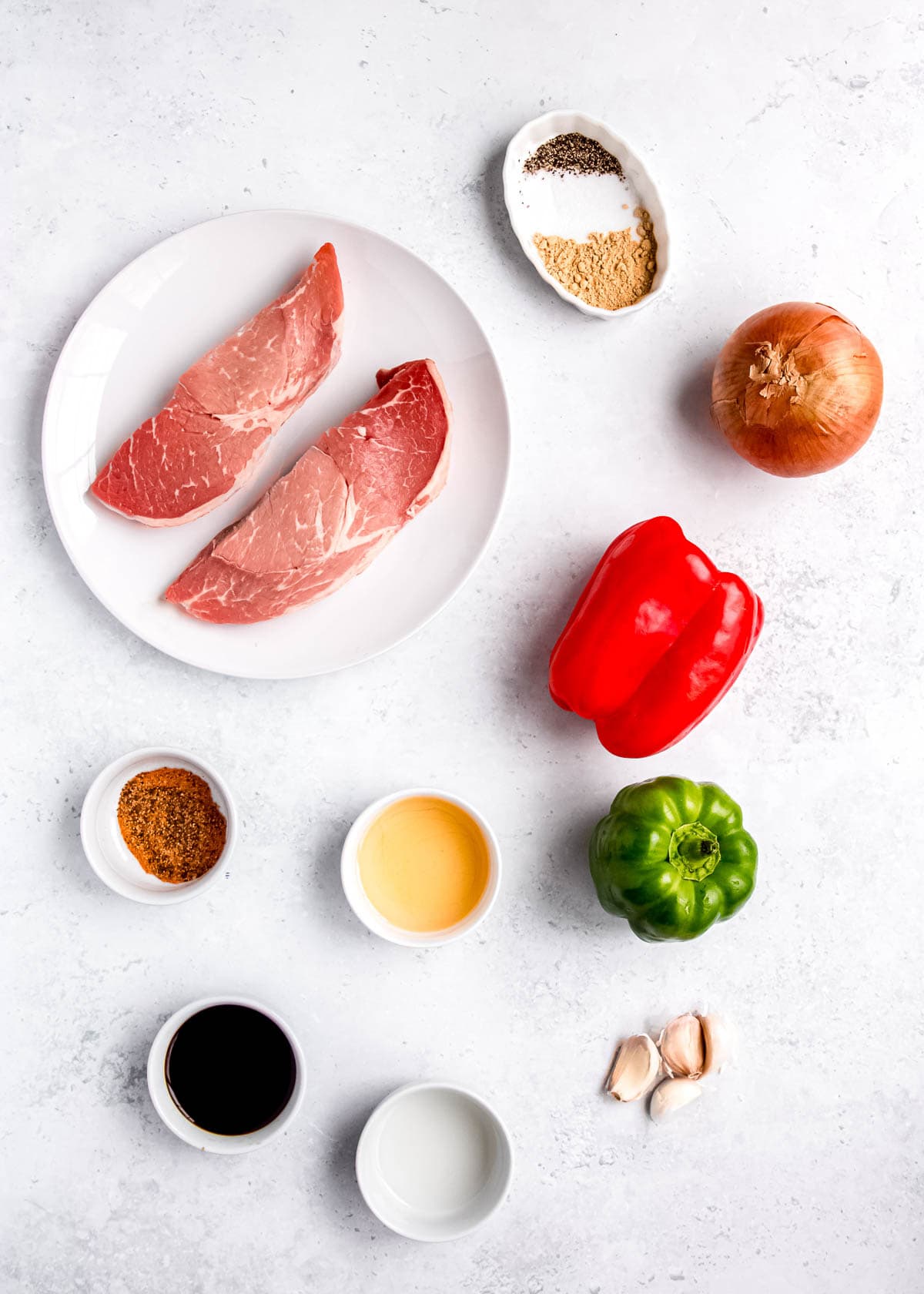 peppe steak ingredients on a white table