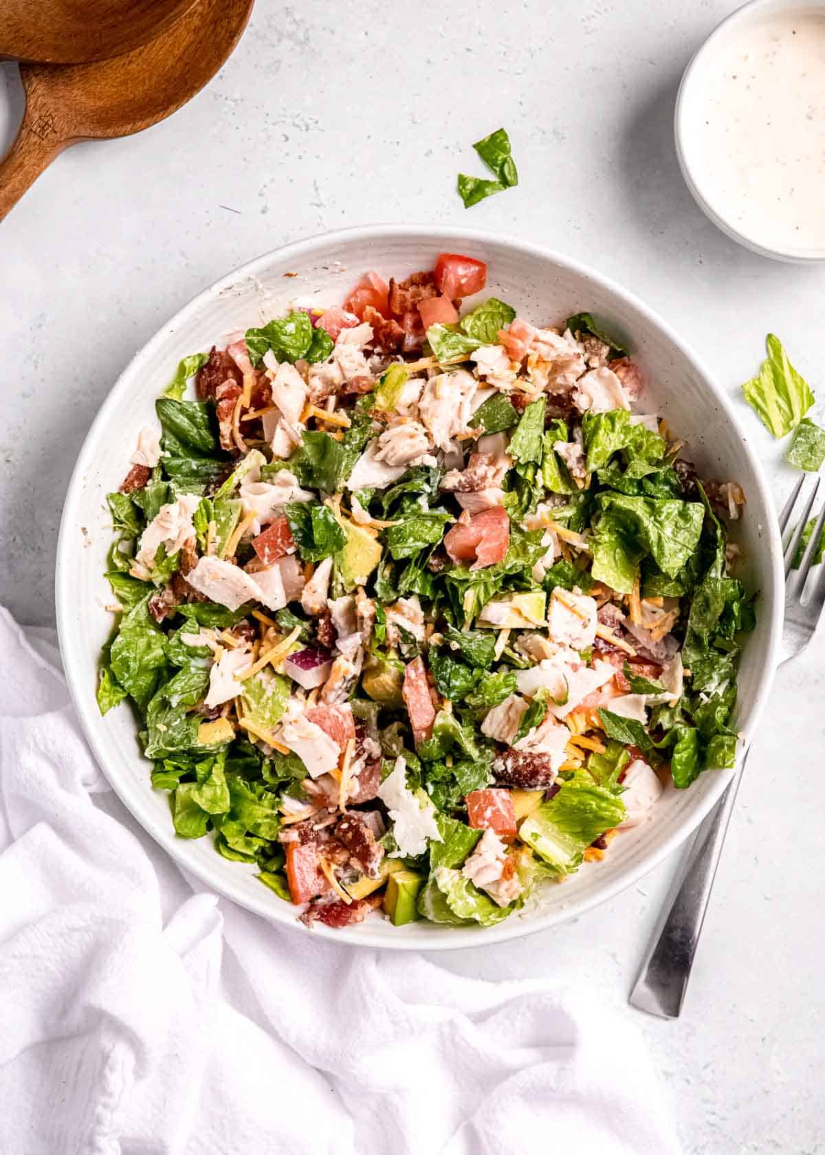 overhead image of dressed turkey bacon sub in a tub