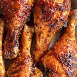 a platter filled with crispy BBQ chicken legs from the air fryer