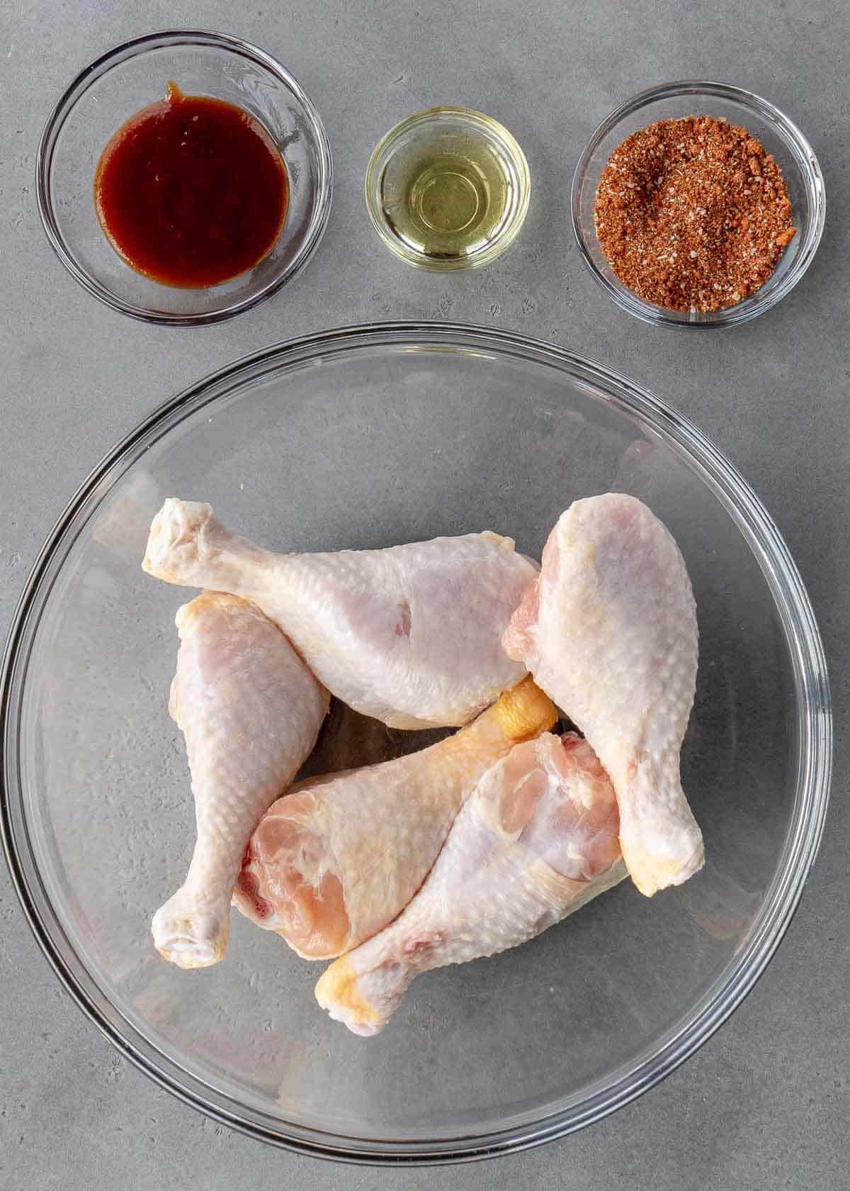 ingredients for bbq chicken legs in individual small glass bowls