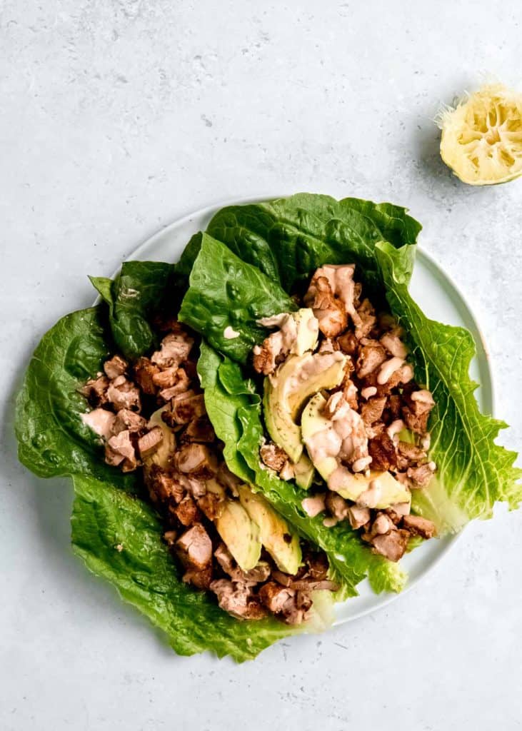 chipotle sauce on chicken lettuce wraps with avocado