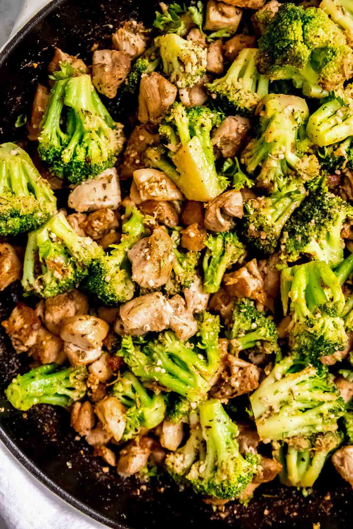 closeup view of juicy garlic butter chicken broccoli skillet