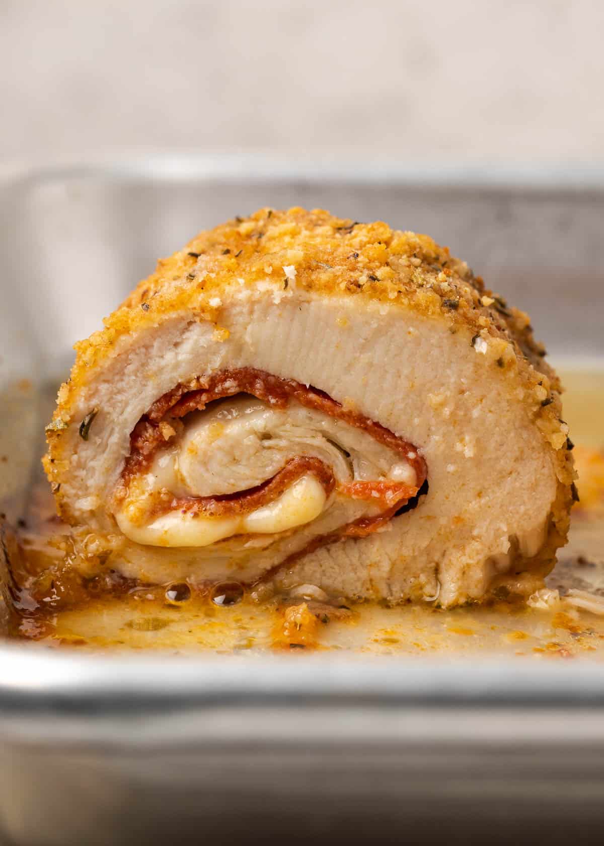 a close up shot of pepperoni stuffed chicken