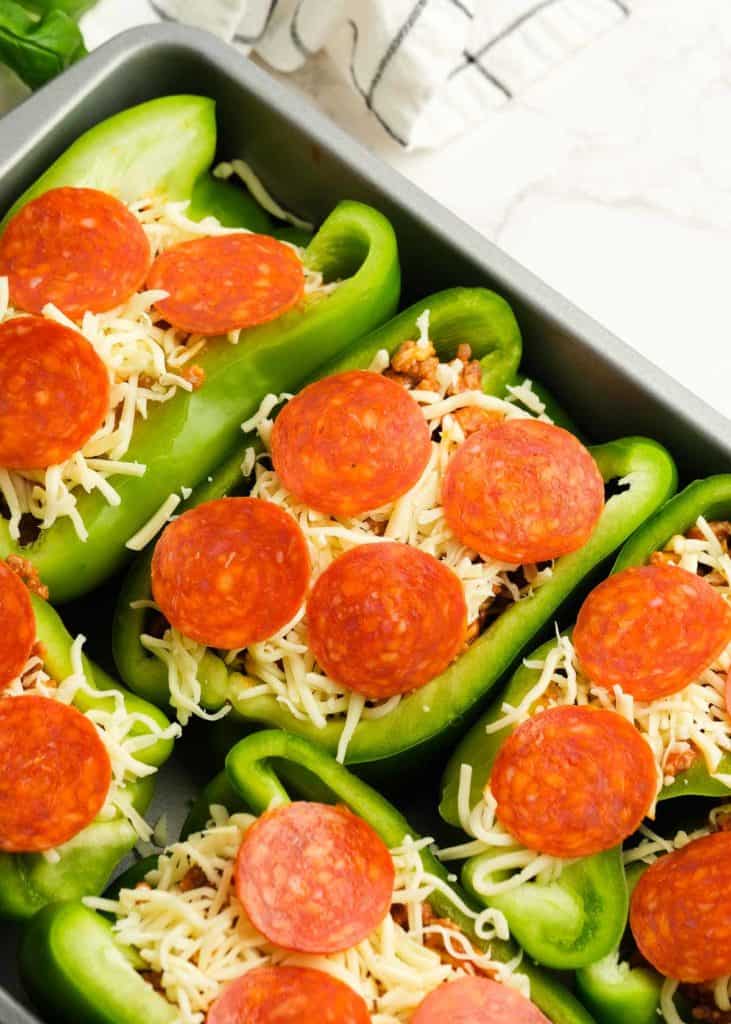 bell peppers filled with meat pizza filling and topped with shredded mozzarella and pepperoni slices