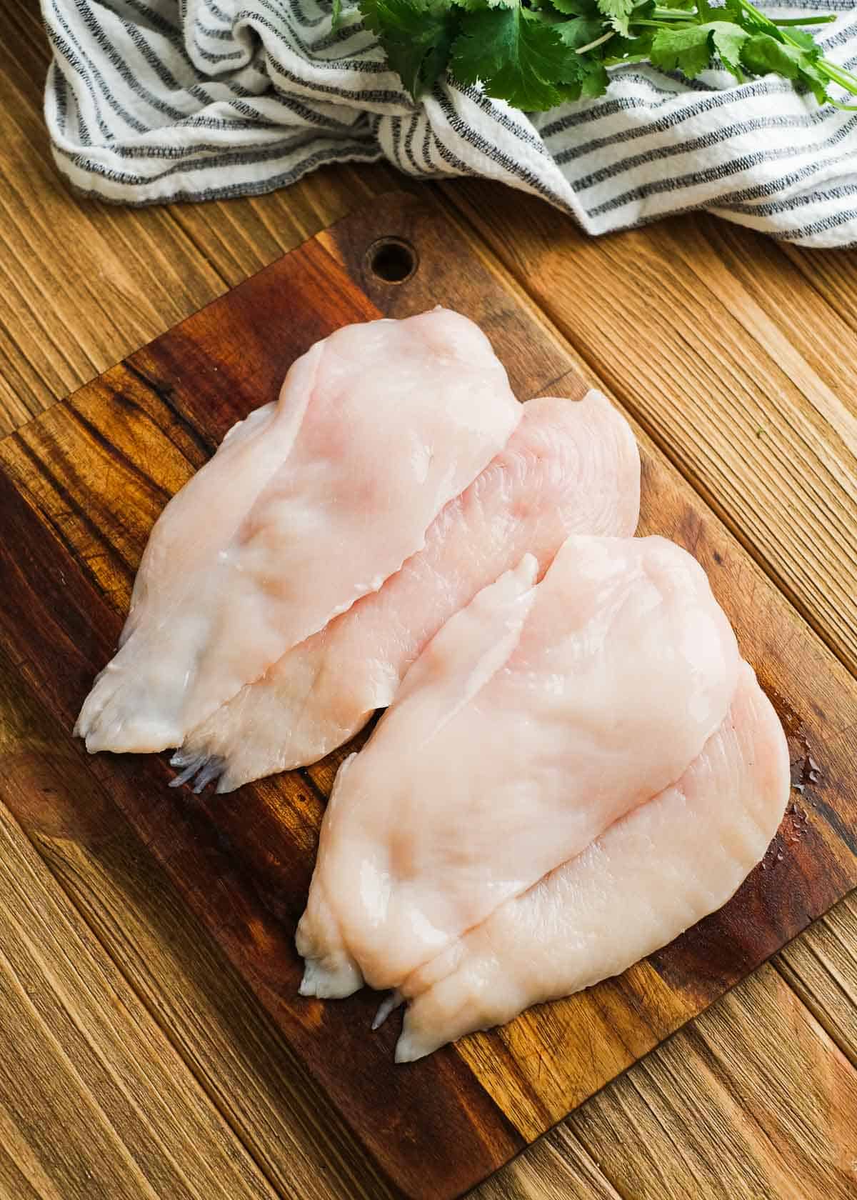 chicken breasts sliced thinly into smaller chicken cutlets for the grill