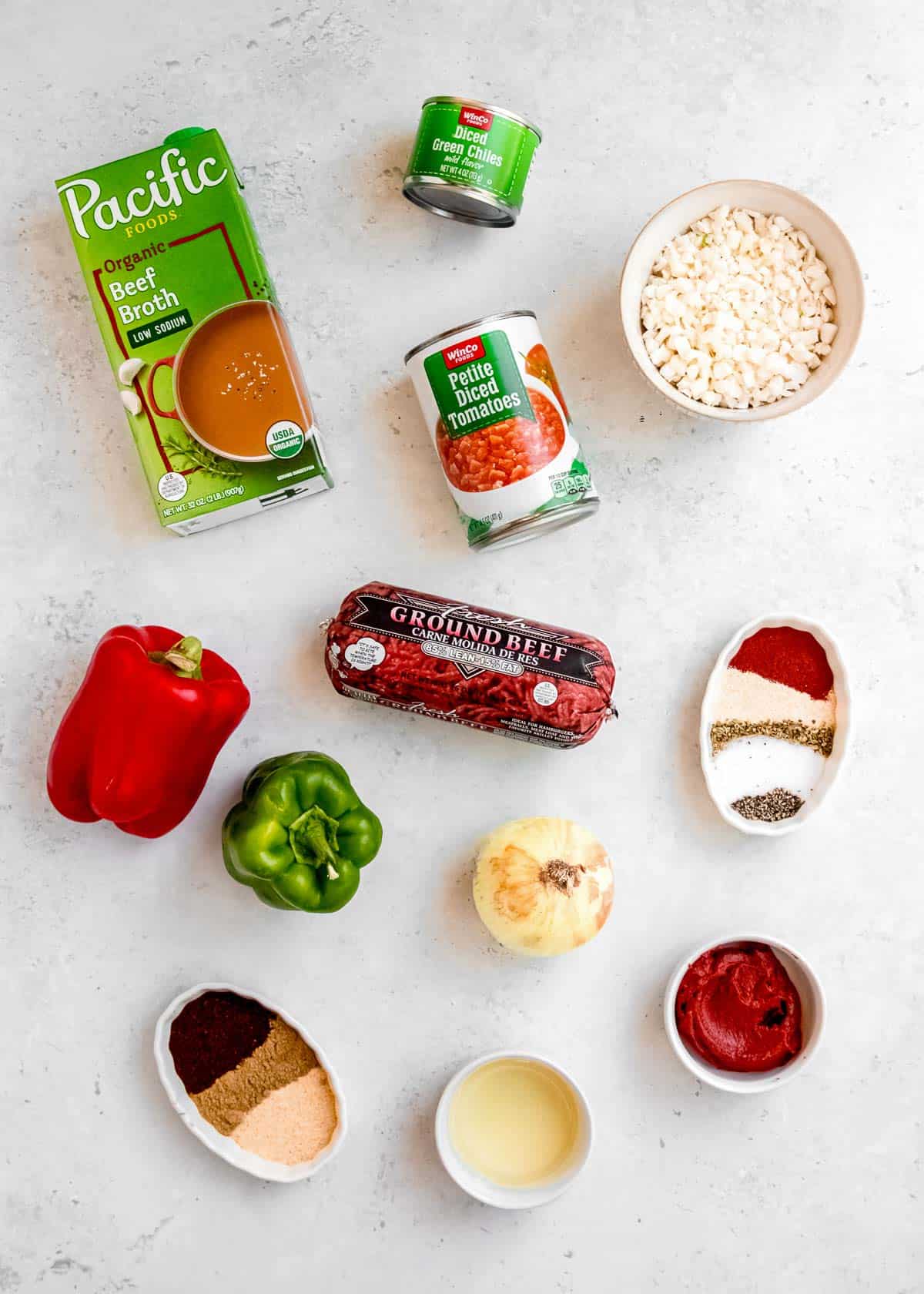 overhead image of taco soup ingredients on a white table 