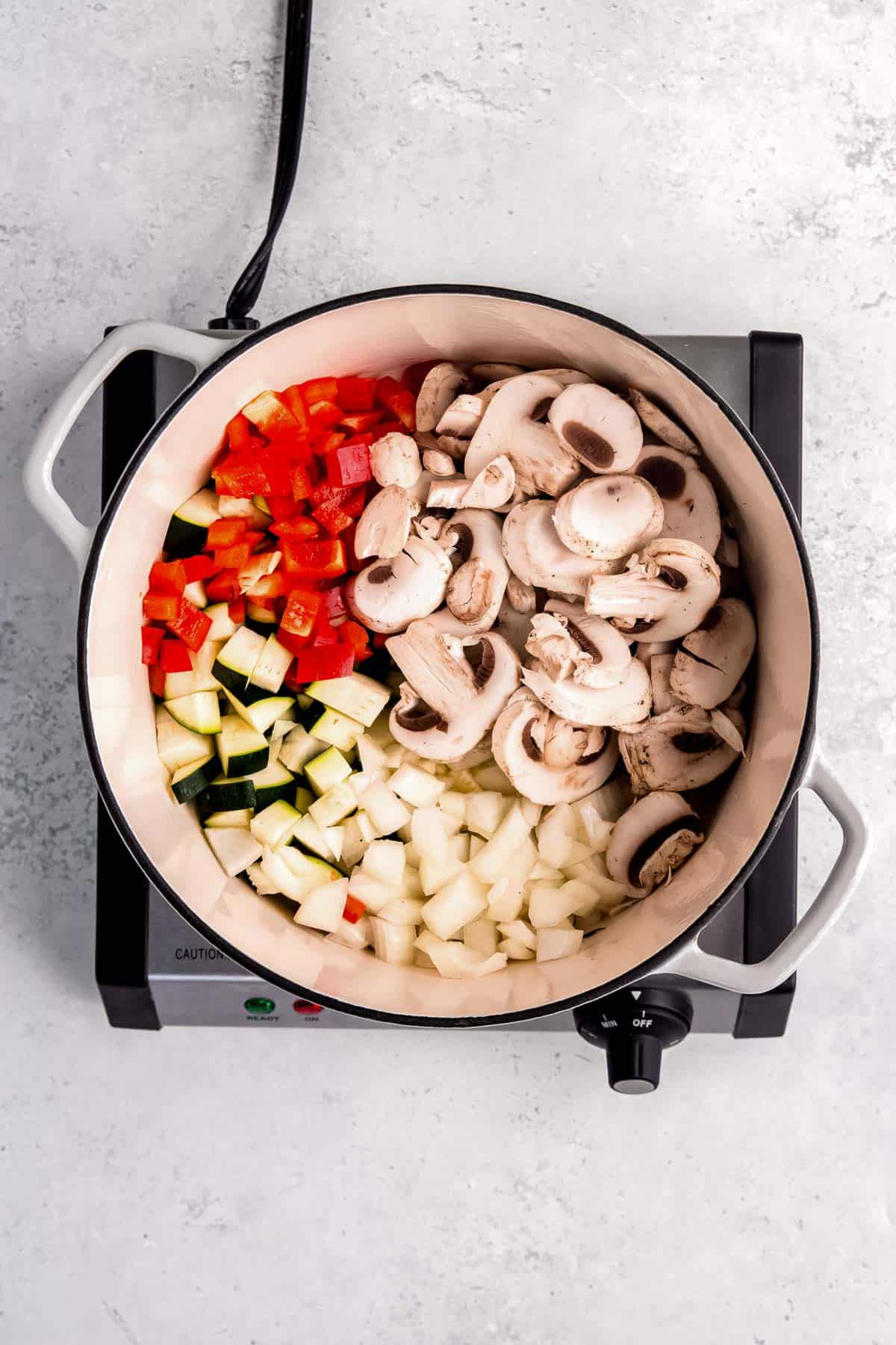 vegetables being sauteed in dutch oven