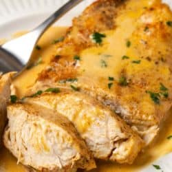 a sliced chicken breast in a creamy cajun chicken sauce