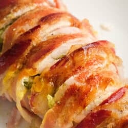 overhead image of sliced bacon wrapped stuffed chicken