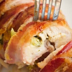 close up image of sliced, chicken breast with one slice being removed with fork