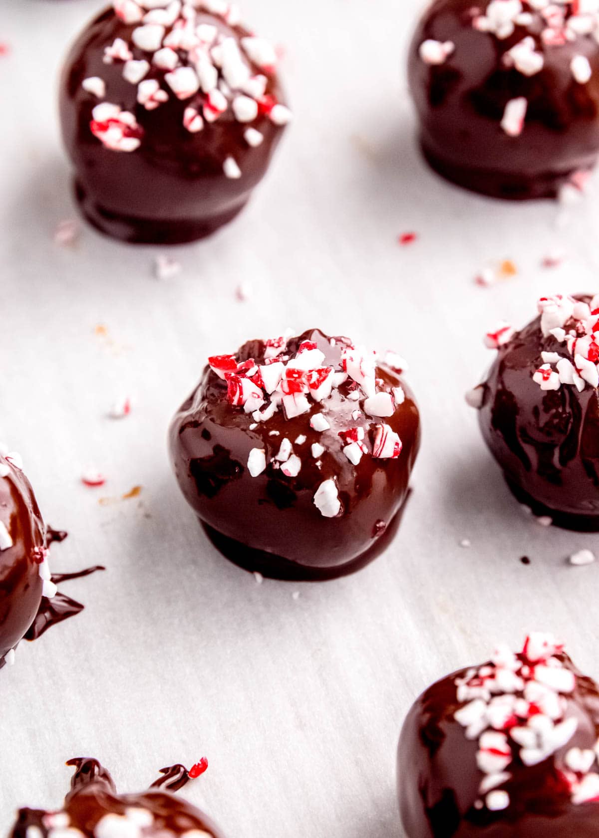 peppermint mocha truffles on a baking sheet after being dipped in coating and allowed to cool