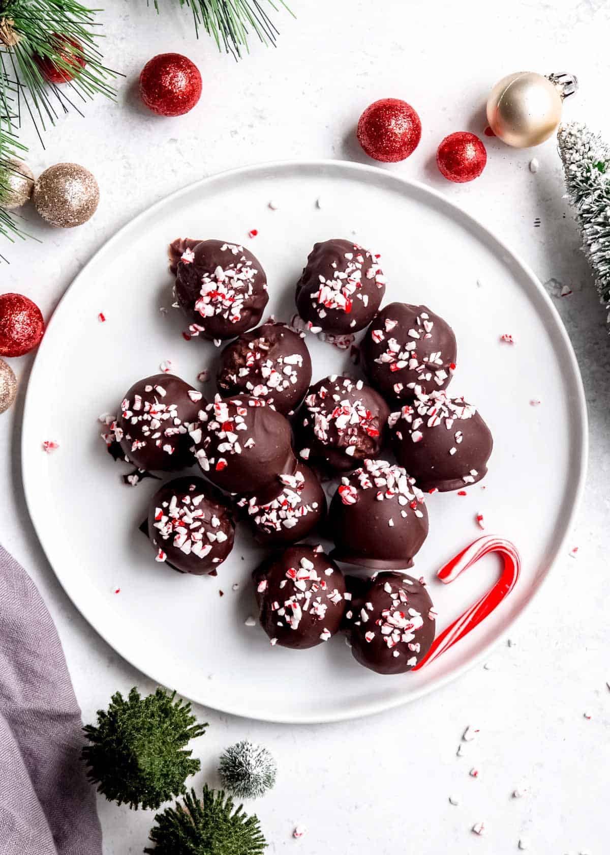 overhead image of peppermint mocha truffles on white plate