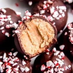 close up image of a stack of peppermint mocha truffles with a bite missing from one truffle